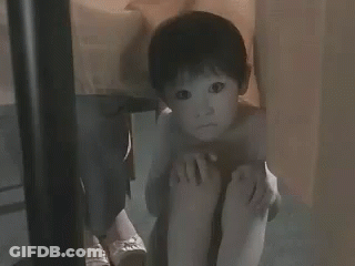 Little Boy Sitting Cross-Legged GIF