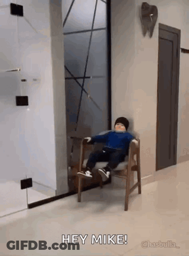 Little Boy Sitting In Waiting Room Saying Hey Mike GIF