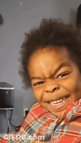 Little Boy Smiling In Plaid Shirt GIF