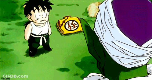 Little Boy Standing Next To Yellow Bag With Chinese Symbol GIF