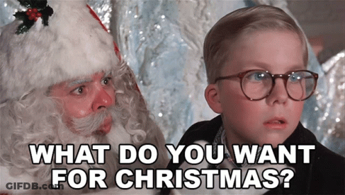 Little Boy With Glasses Talking To Santa Claus Saying What Do You Want For Christmas GIF