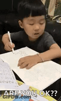 Little Boy Writing In Notebook GIF