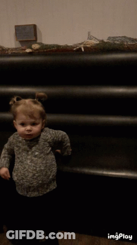Little Girl At Black Staircase With Imgplay Sign GIF