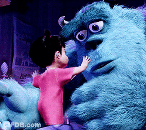Little Girl Beside Monsters Inc Stuffed Monster GIF