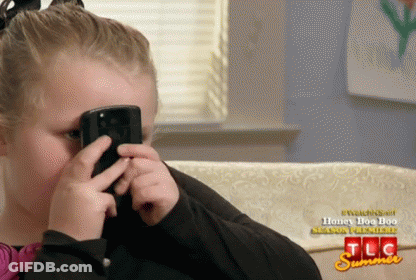 Little Girl Covering Face With Cell Phone Watching TLC Summer Season Premiere GIF