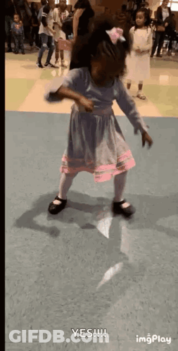 Little Girl Dancing In Blue And Pink Dress GIF