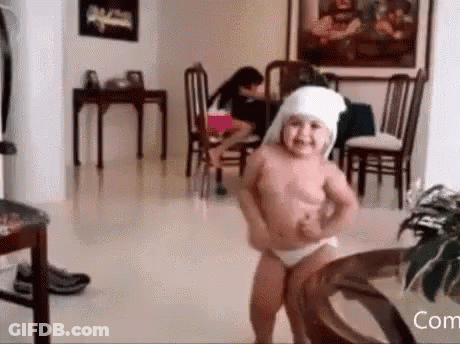 Little Girl Dancing In Diaper And Head Bandage GIF