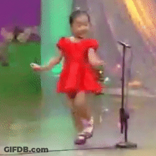 Little Girl Dancing In Front Of Microphone GIF