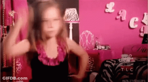 Little Girl Dancing In Front Of Pink Lace Wall GIF