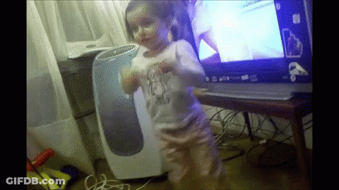 Little Girl Dancing In Front Of Windows Laptop GIF