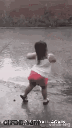Little Girl Dancing In Rain Playing Volleyball GIF