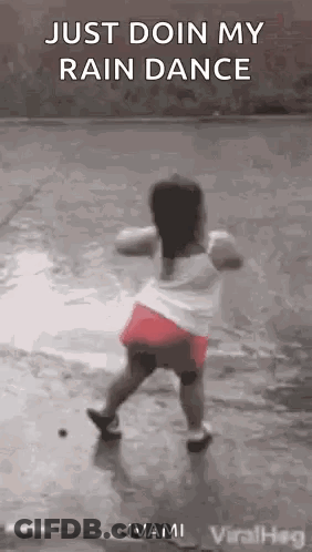 Little Girl Dancing In The Rain GIF