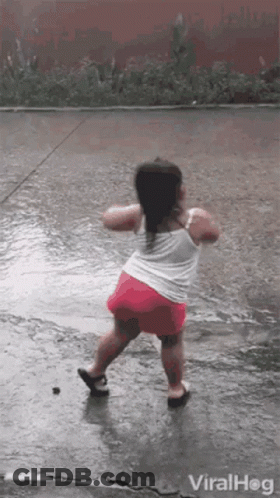 Little Girl Dancing In The Rain GIF