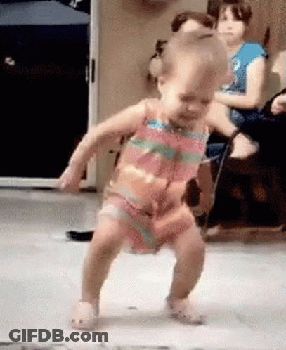 Little Girl Dancing While People Watch GIF