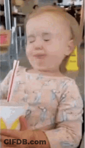 Little Girl Drinking Through Straw GIF