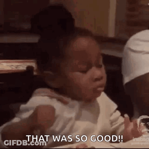 Little Girl Eating At Table GIF