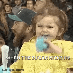 Little Girl Eating Blue Cotton Candy In Crowd GIF