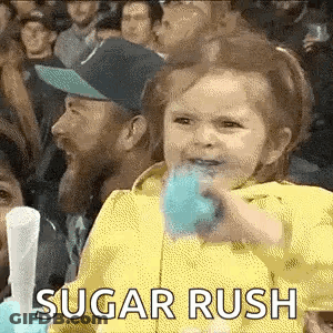 Little Girl Eating Cotton Candy In Crowd GIF