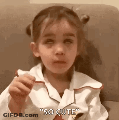 Little Girl Eating Food Making Face GIF