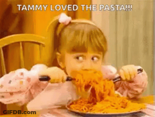 Little Girl Eating Spaghetti With Fork And Knife GIF