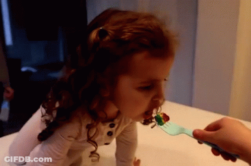 Little Girl Fed By Fork GIF