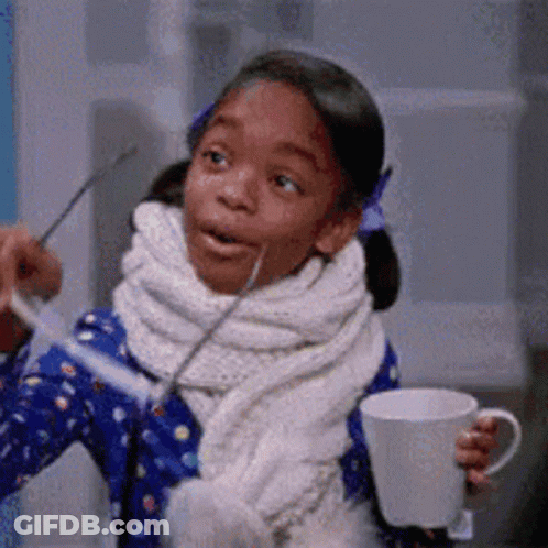 Little Girl Holding Coffee Cup And Spoon GIF