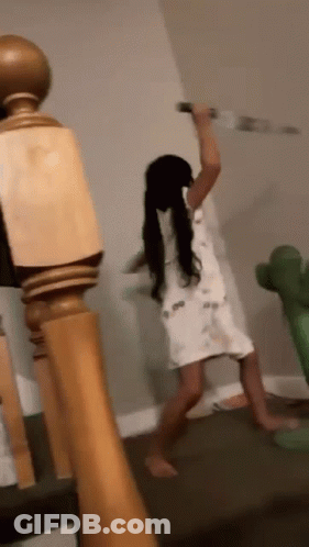 Little Girl Holding Knife On Staircase GIF