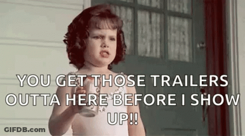 Little Girl Holding Milk Making Funny Face At Door GIF