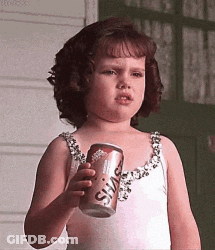 Little Girl Holding Soda Making Face GIF