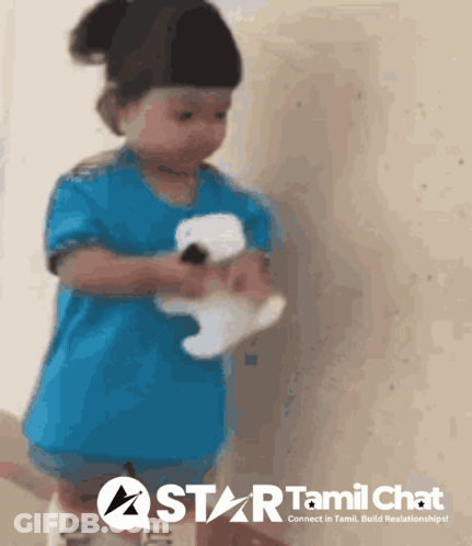Little Girl Holding Stuffed Animal In Front Of Star Tamil Chat Sign GIF