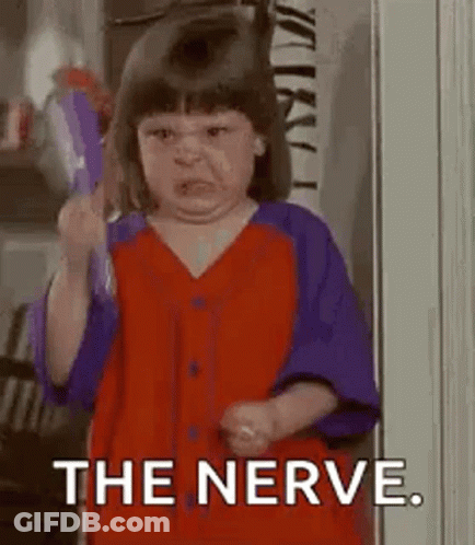 Little Girl Holding Toothbrush Making Face GIF