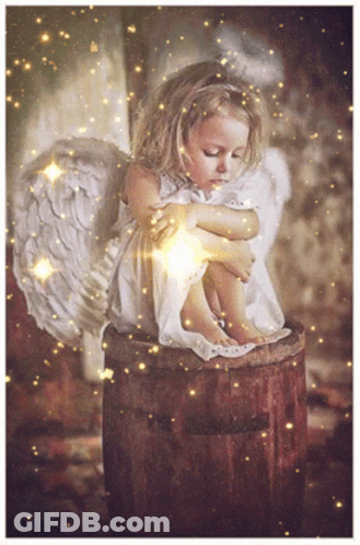Little Girl In Angel Wings Sitting On Wooden Barrel GIF
