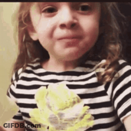 Little Girl In Black And White Striped Shirt Eating Cake GIF