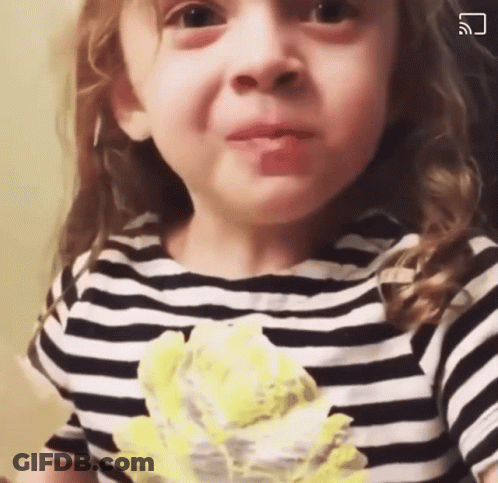 Little Girl In Black And White Striped Shirt Making A Face GIF