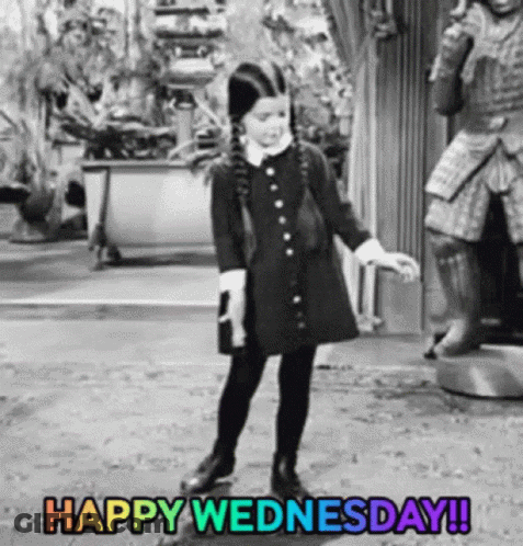 Little Girl In Black Dress Dancing In Front Of Statue Happy Wednesday GIF