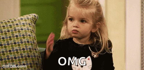 Little Girl In Black Shirt With Cat Says Omg GIF