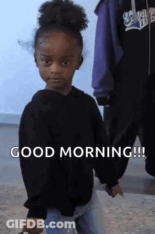 Little Girl In Black Sweater Holding Water Bottle Saying Good Morning GIF