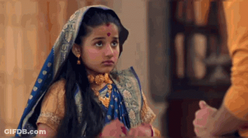 Little Girl In Blue And Gold Costume Holding Man's Hand GIF
