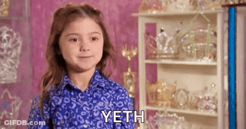Little Girl In Blue Shirt By Trophy Shelf GIF