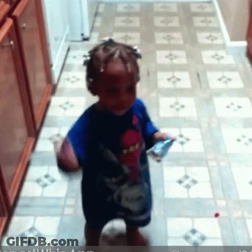 Little Girl In Blue Shirt On Tile Floor GIF