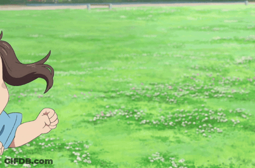 Little Girl In Blue Shirt Standing In Field GIF