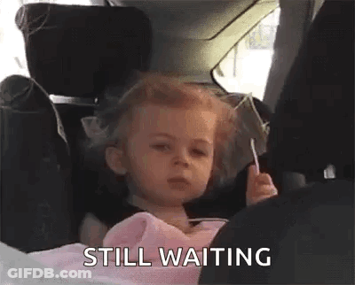 Little Girl In Car Seat Holding Lollipop GIF