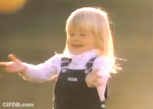 Little Girl In Overalls Smiling GIF