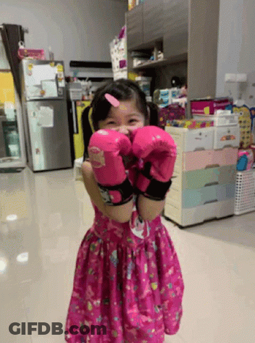 Little Girl In Pink Boxing Gloves GIF