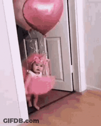 Little Girl In Pink Dress Holding Pink Heart Balloon GIF
