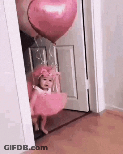 Little Girl In Pink Dress Holding Pink Heart Balloon GIF