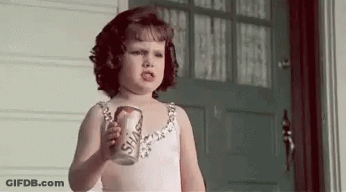 Little Girl In Pink Dress Holding Soda GIF