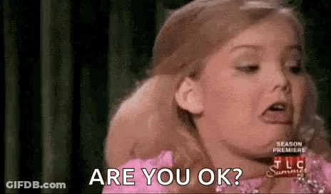 Little Girl In Pink Dress Making Funny Face Asking Are You Ok GIF