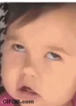 Little Girl In Pink Dress Smiling In Chair GIF