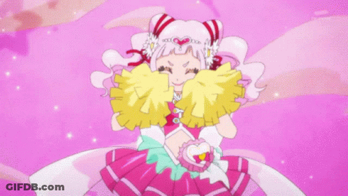 Little Girl In Pink Dress Surrounded By Cheerleaders With Pom Poms GIF